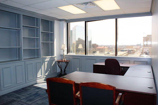 Sixth-floor private office with built-in shelving and downtown Amarillo skyline views